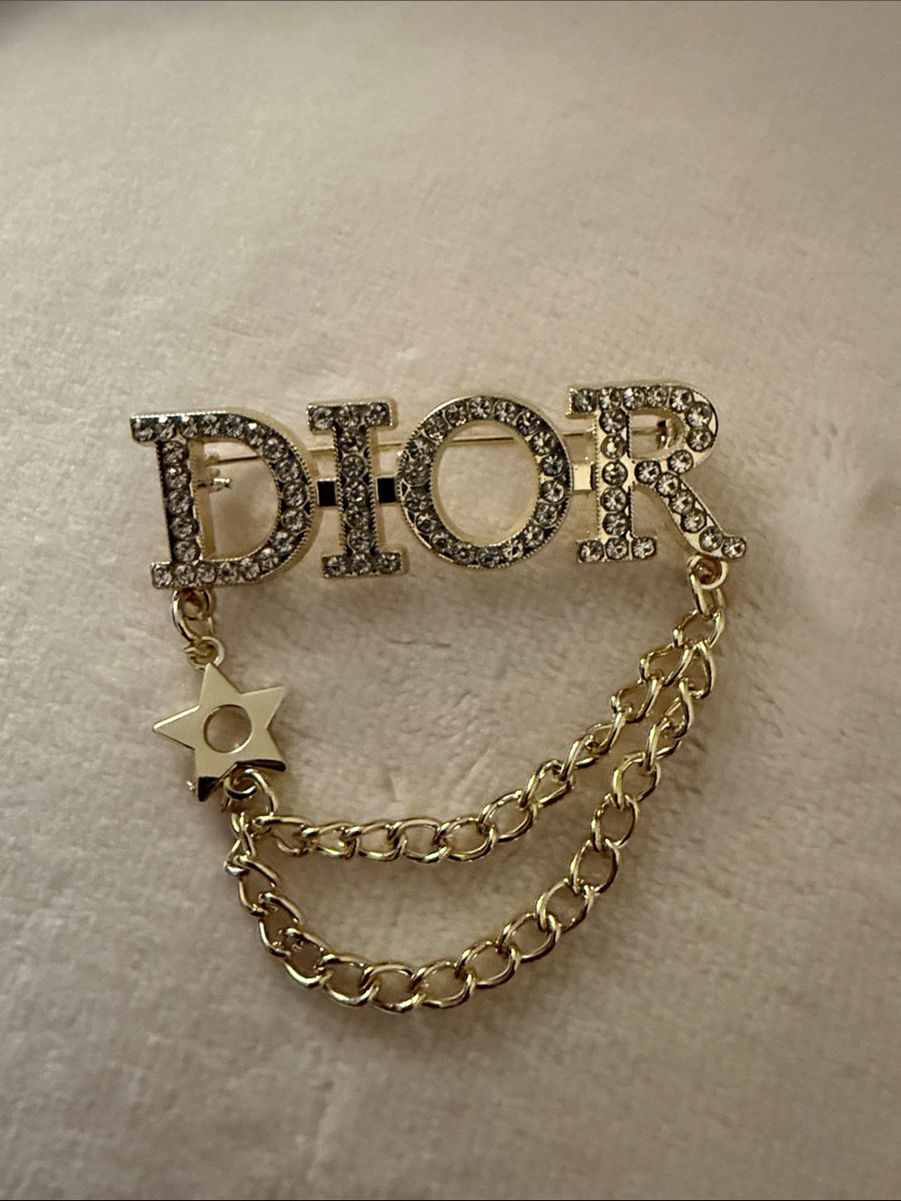 Gold Crystal Logo Chain Brooch